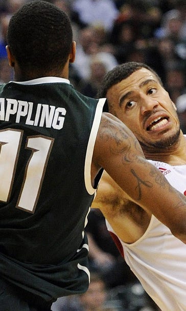 Wisconsin endures Michigan State's wrath in league-tourney slugfest